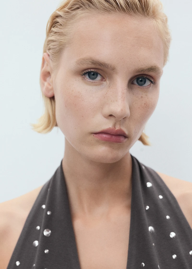 Halter top with metallic appliqués