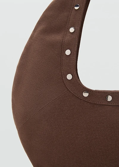 Oval studded shoulder bag