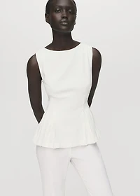 Peplum top with pleat detail