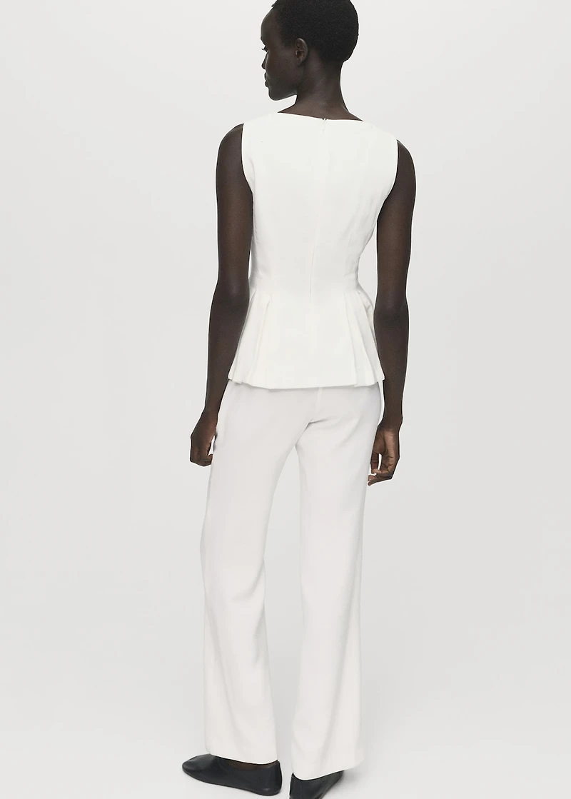 Peplum top with pleat detail