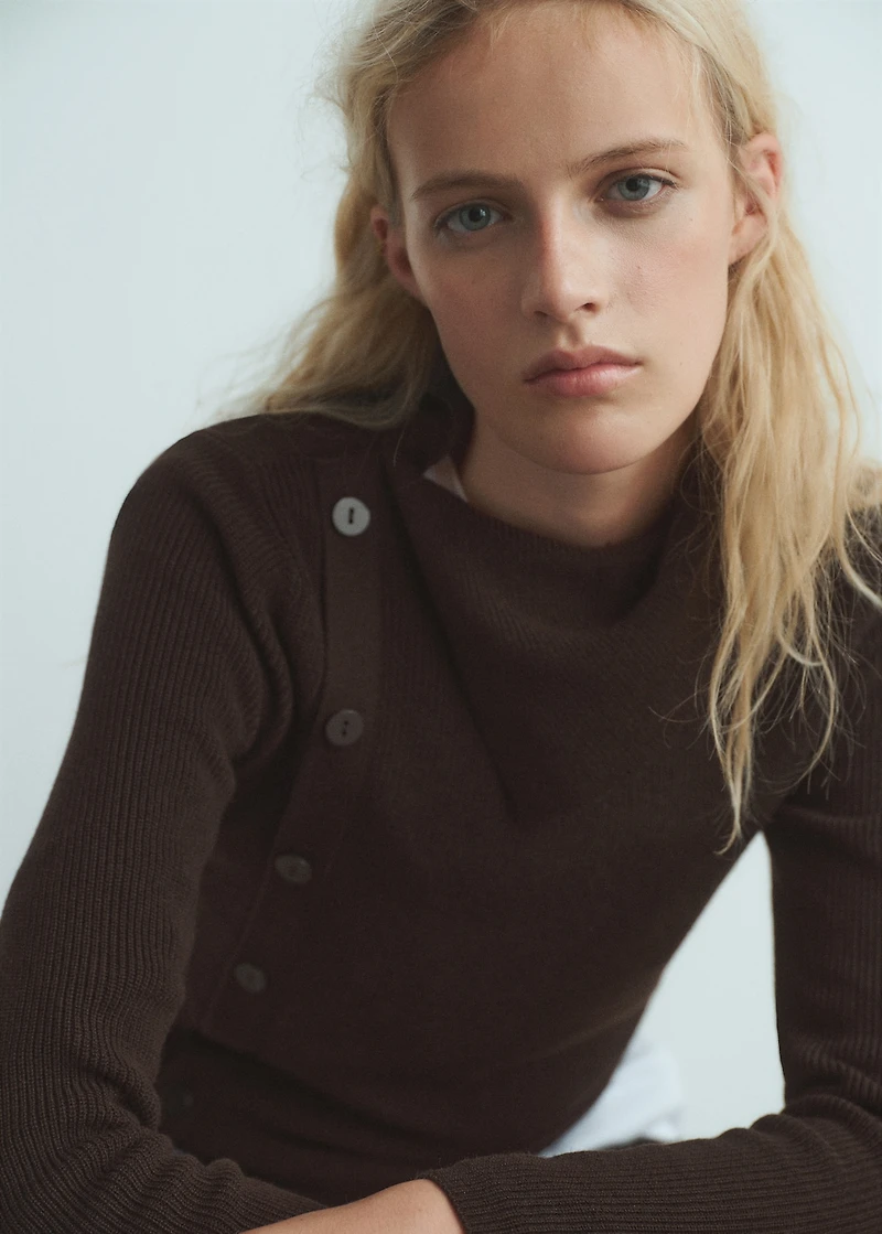 Sweater with asymmetrical neck and buttons