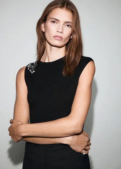 Knitted top with metallic flower