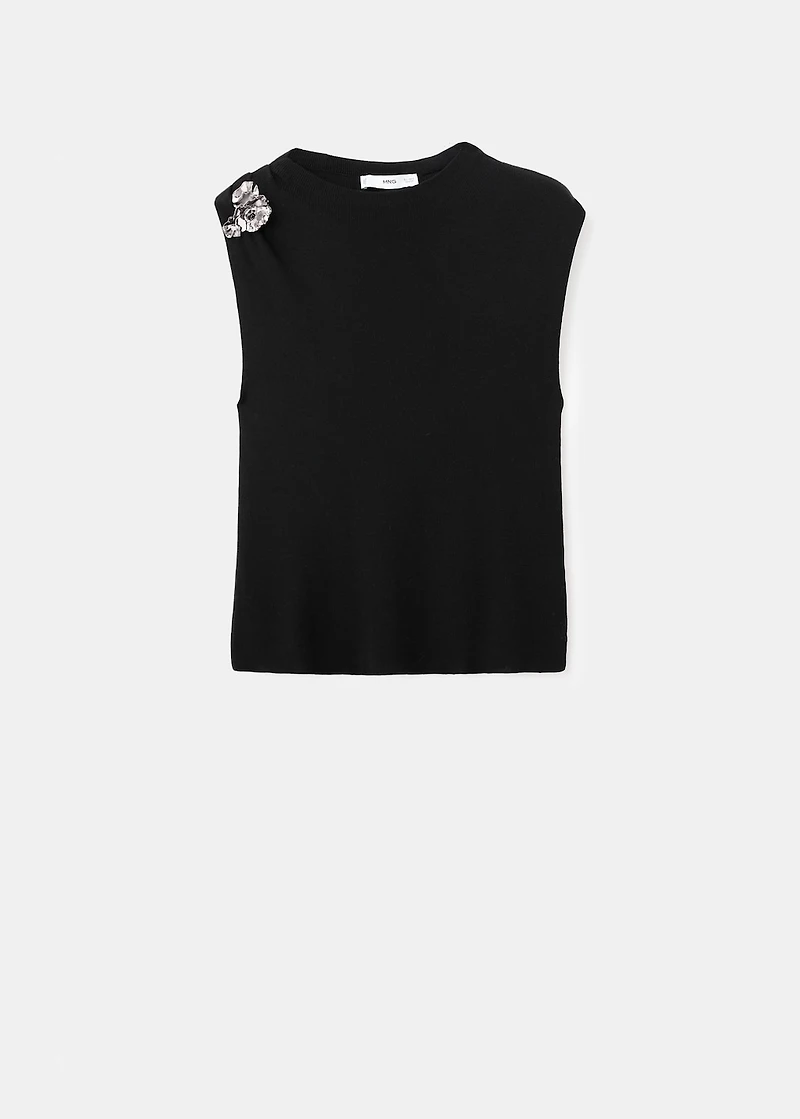 Knitted top with metallic flower