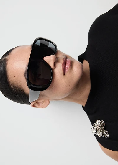 Knitted top with metallic flower