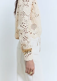 Knitted jacket with scalloped hem