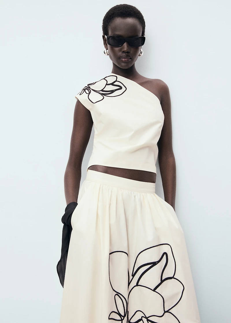 Asymmetrical flower-embroidered top