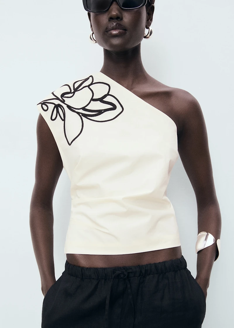 Asymmetrical flower-embroidered top