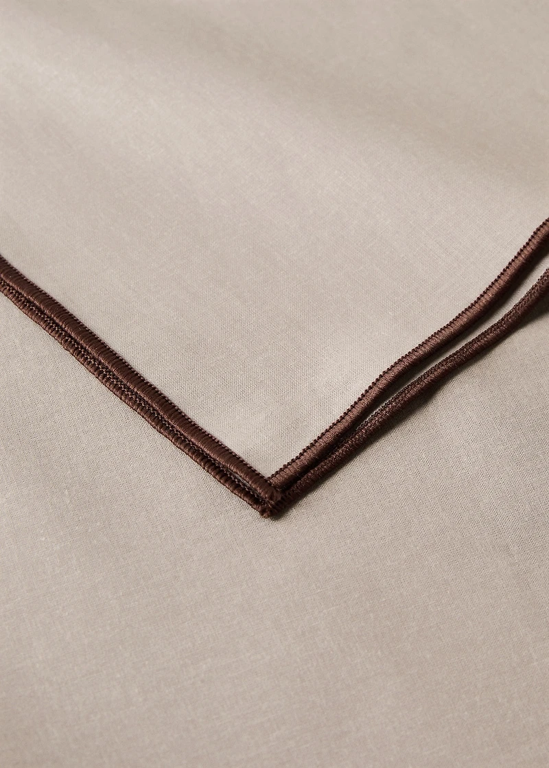 Resin-coated cotton tablecloth with overlock stitching for 6 to 8 diners