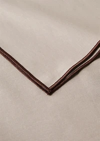 Resin-coated cotton tablecloth with overlock stitching for 6 to 8 diners