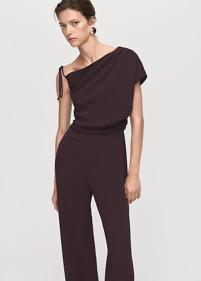 Jumpsuit with asymmetrical neck and bow
