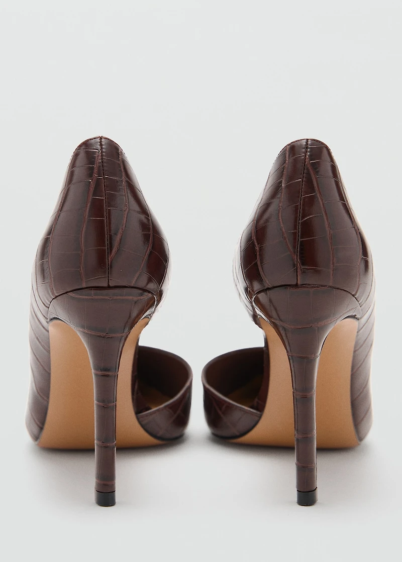 Asymmetrical croc-effect heeled shoes
