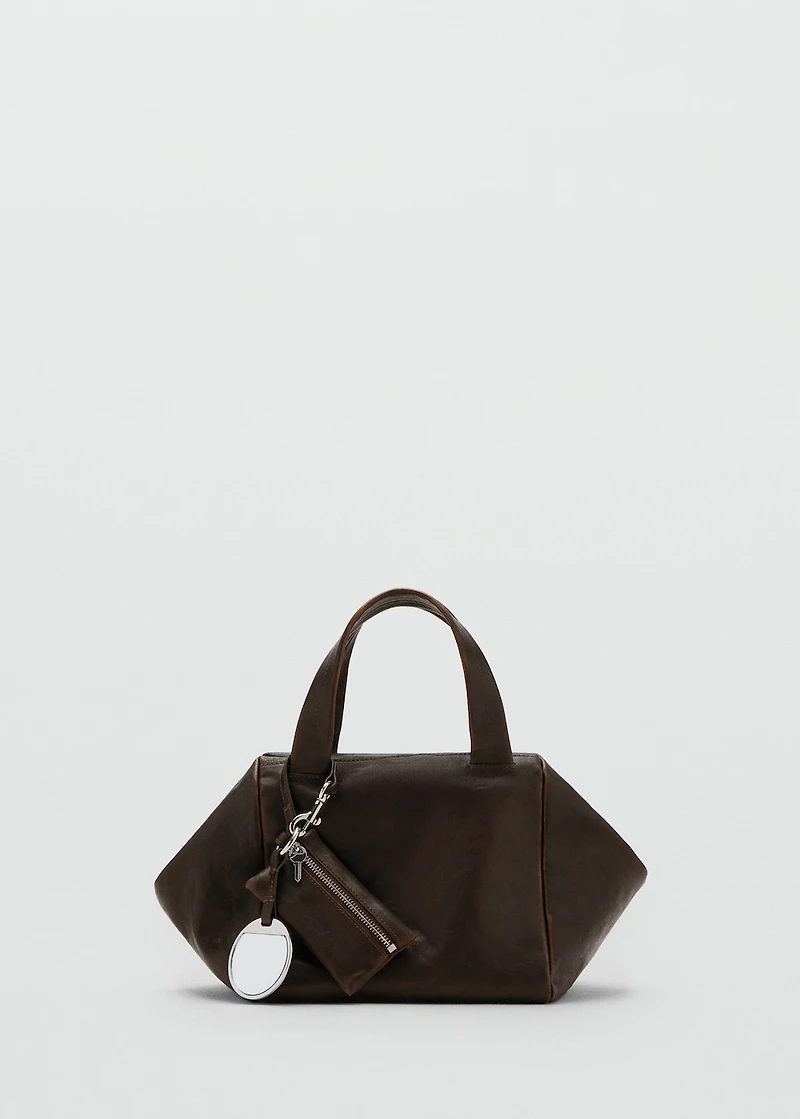 Leather clutch bag with charms