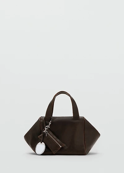 Leather clutch bag with charms