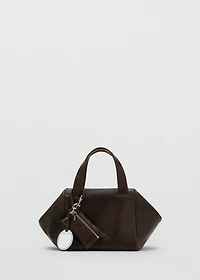 Leather clutch bag with charms