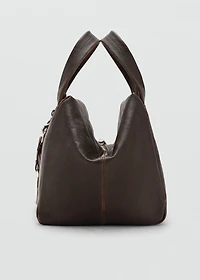 Leather clutch bag with charms