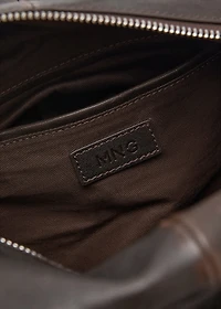 Leather clutch bag with charms