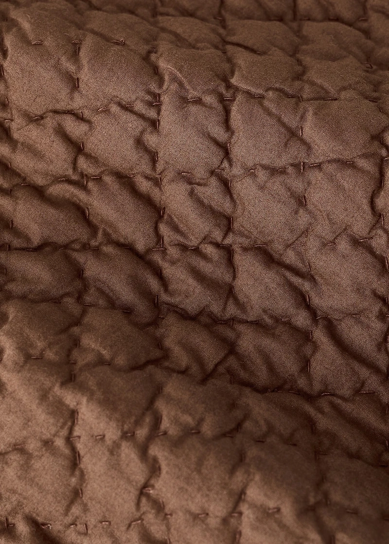 Hand-stitched cotton bedspread for cot