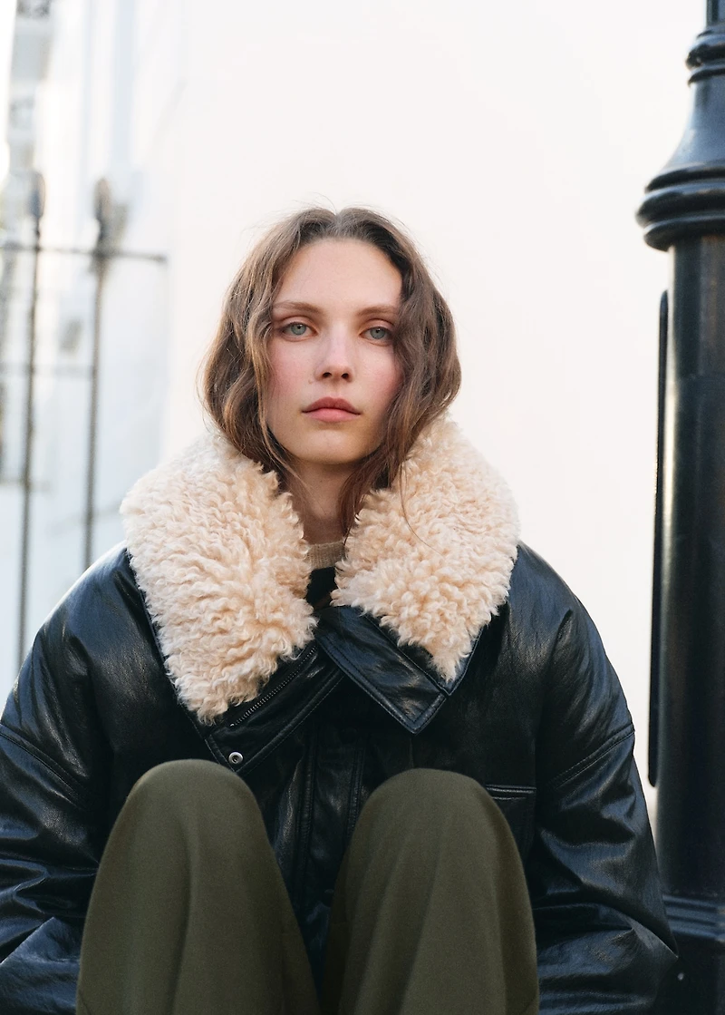 Pleated trousers with button detail