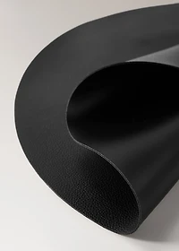 Round leather-effect placemat