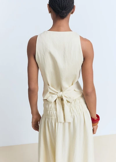 Vest with bow on the back