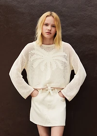 Knit sweater with lace pattern