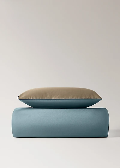 Reversible percale cotton duvet cover with contrasting piping for cot