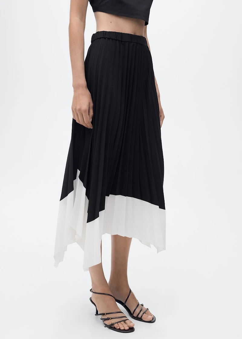 Pleated asymmetric skirt