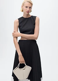Pleated asymmetric skirt