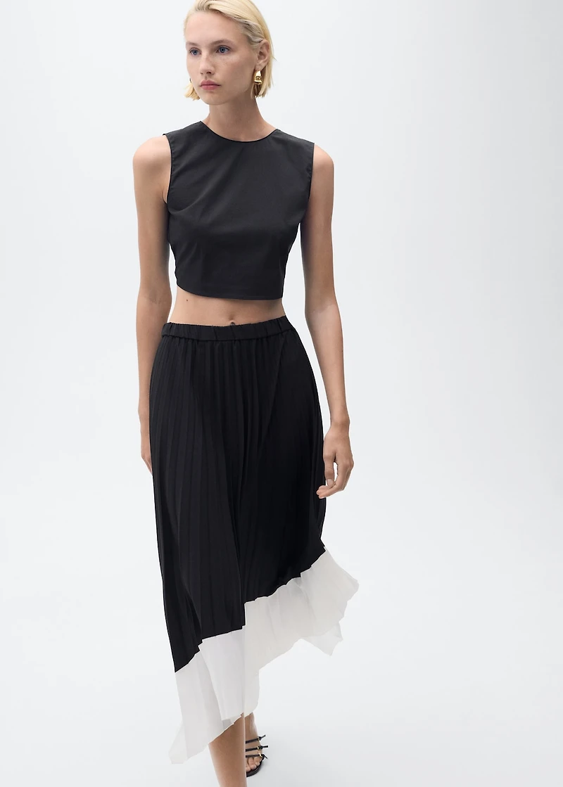 Pleated asymmetric skirt