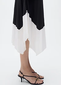 Pleated asymmetric skirt