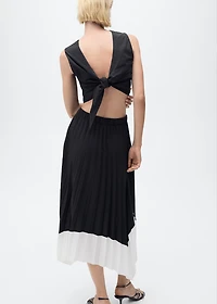 Pleated asymmetric skirt