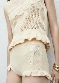 Knit vest with ruffle details