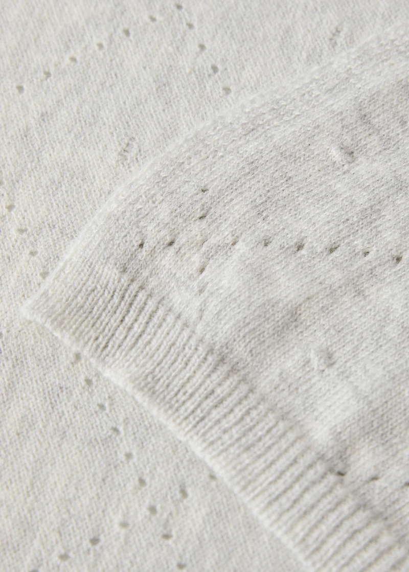 Embroidered children’s blanket with rhombus design