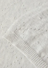 Embroidered children’s blanket with rhombus design