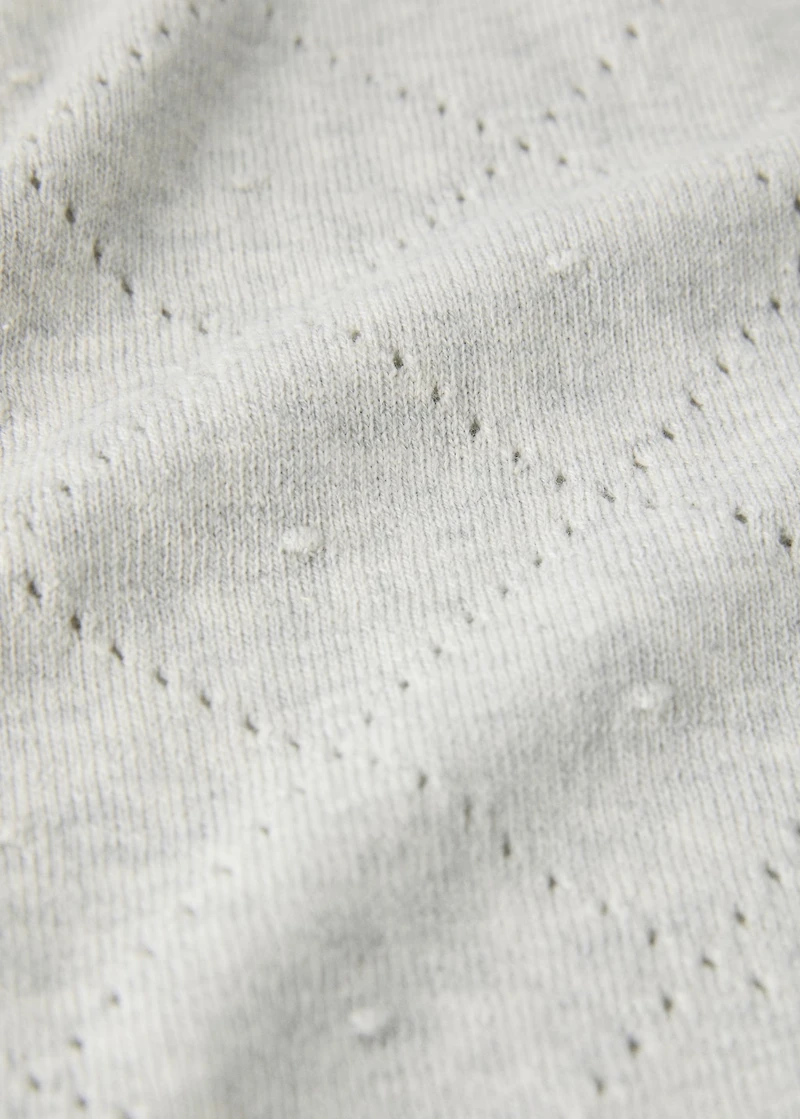 Embroidered children’s blanket with rhombus design