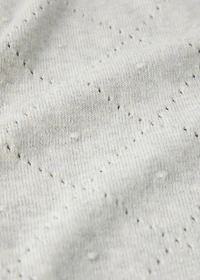 Embroidered children’s blanket with rhombus design