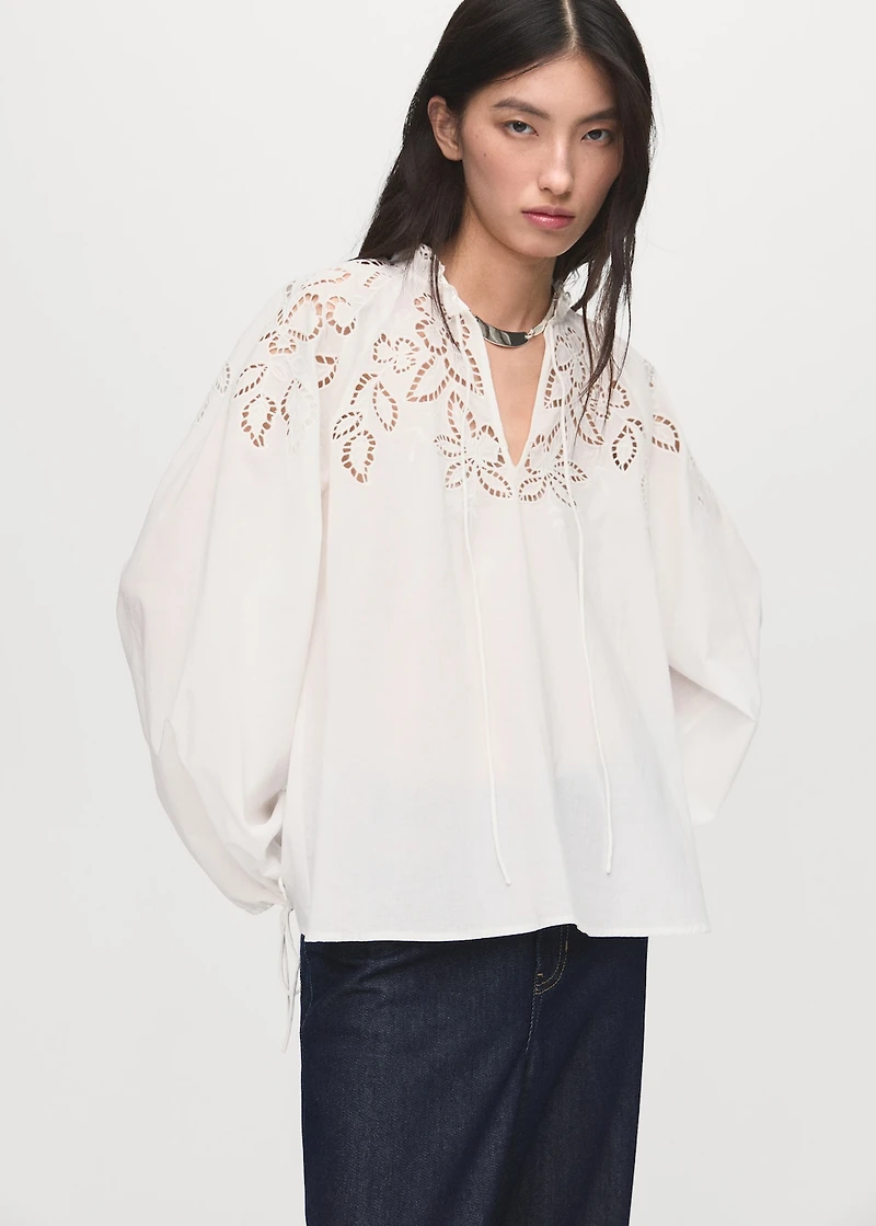 Embroidered blouse with bows