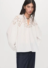 Embroidered blouse with bows