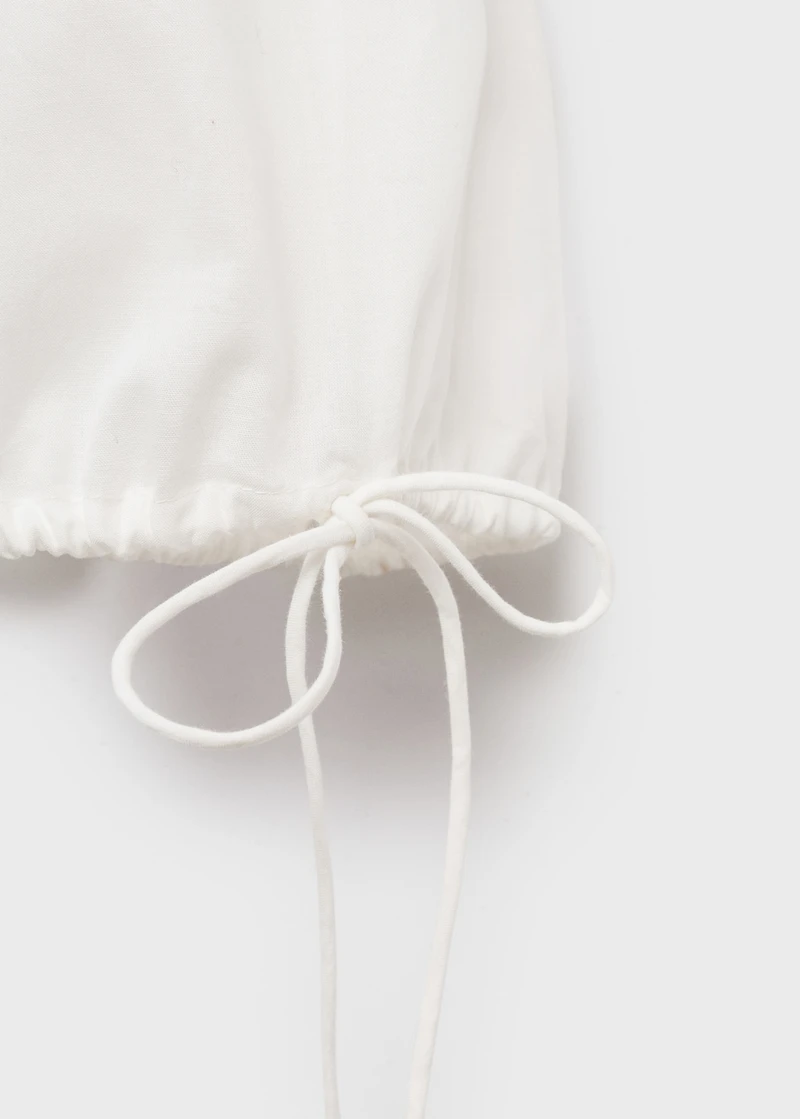 Embroidered blouse with bows