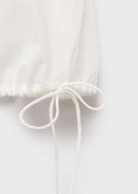 Embroidered blouse with bows