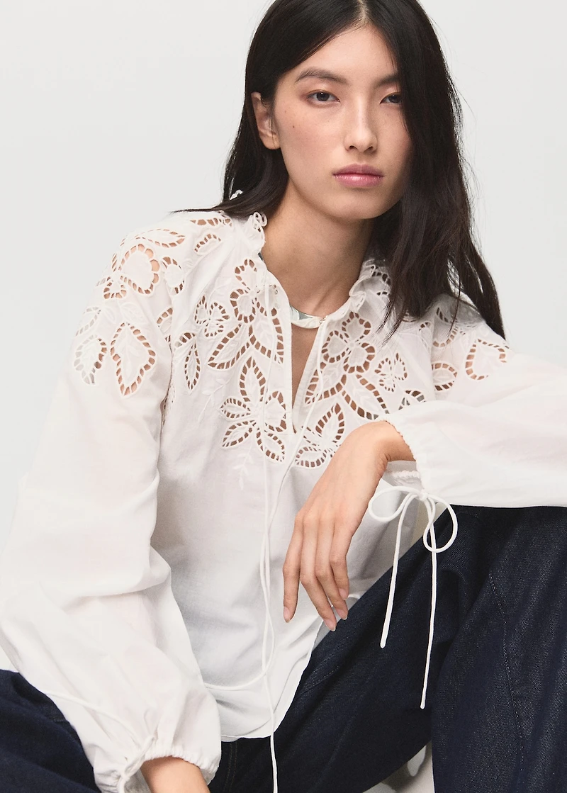 Embroidered blouse with bows