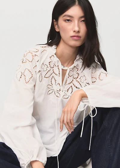 Embroidered blouse with bows