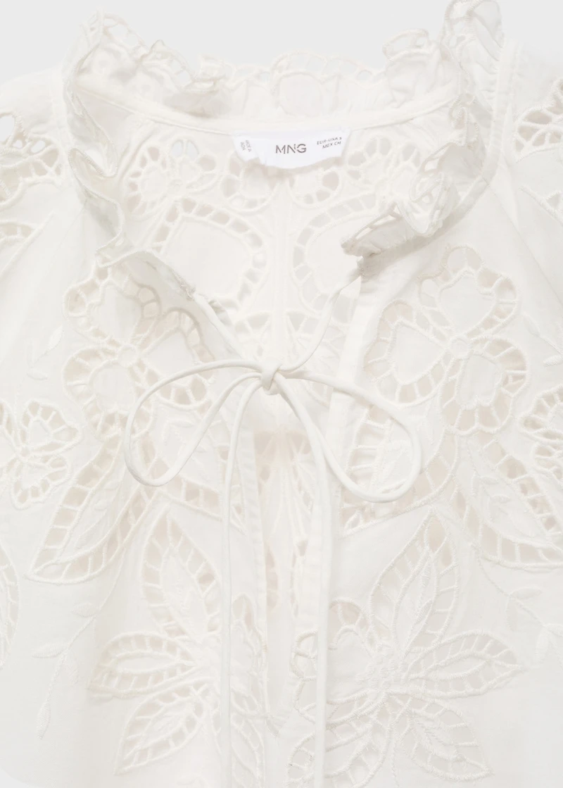 Embroidered blouse with bows