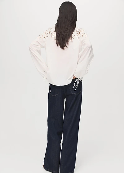 Embroidered blouse with bows