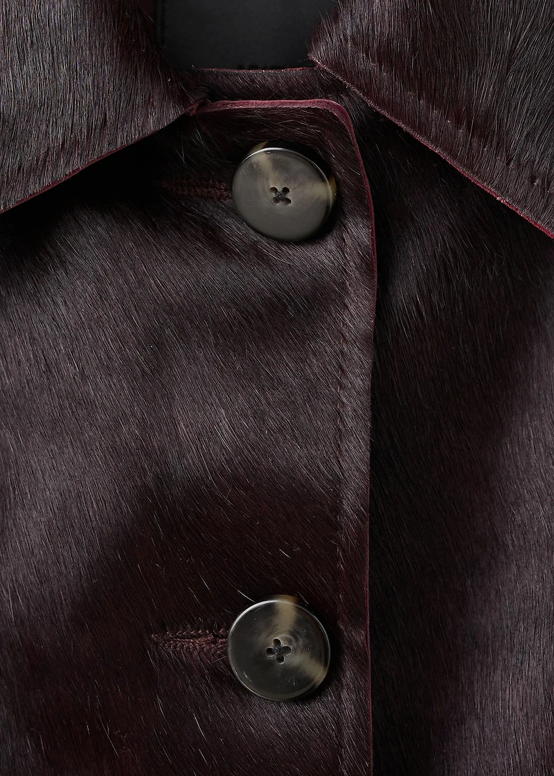 Leather jacket with fur pockets