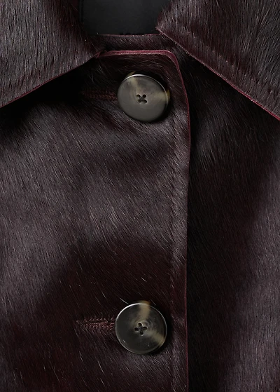 Leather jacket with fur pockets