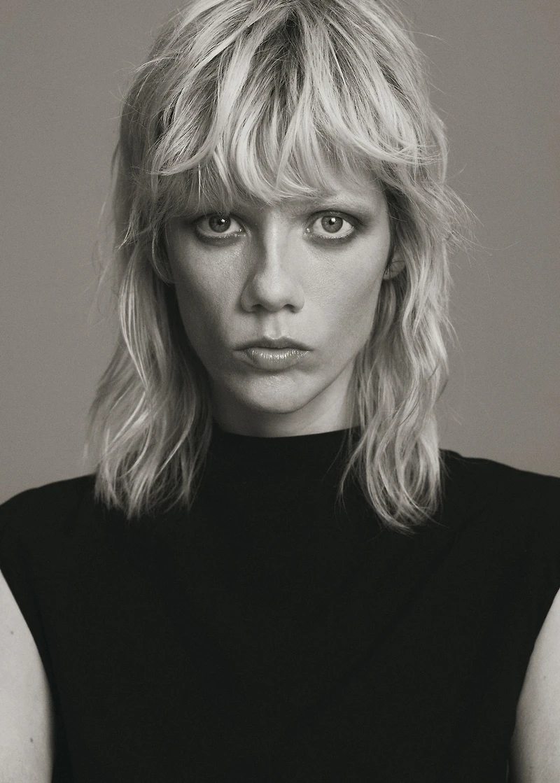 Jumpsuit with draped neck and belt