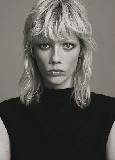 Jumpsuit with draped neck and belt