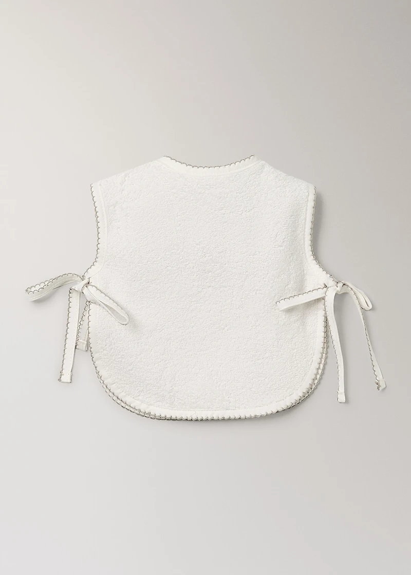 Cotton bib with decorative trim