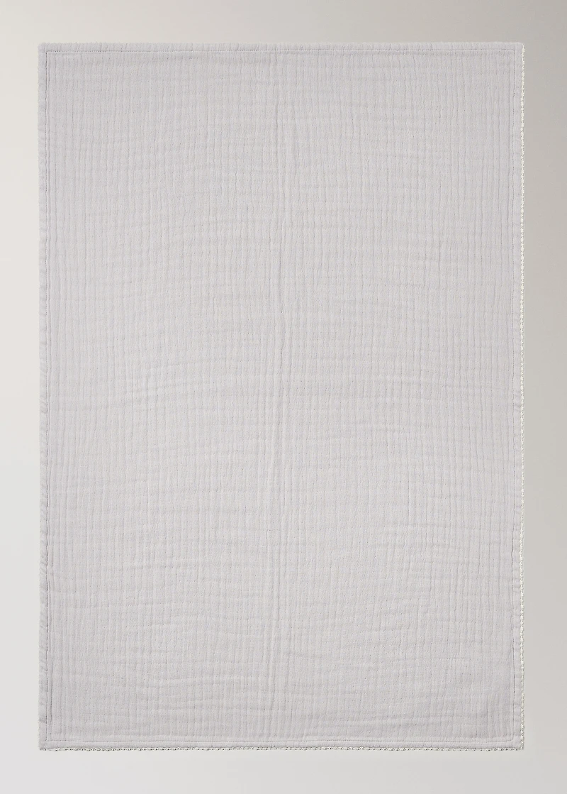 Children's blanket with contrasting finish